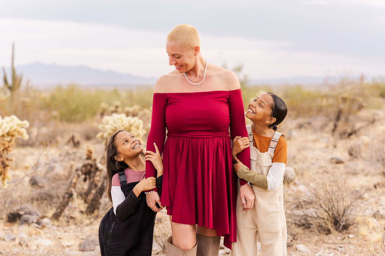 family photographer with client during Christmas photoshoot in Surprise, AZ.