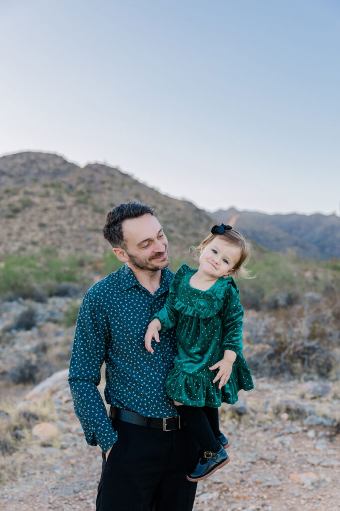 dad holding daughter for family portrait in Surprise AZ.